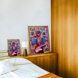 Bowie Ashes to Ashes music wall art print by Caya Crum — framed in a wood-accent room