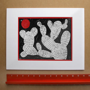 Cosmic Prickly Pear Red Moon cactus art print by Caya Crum — with white mat