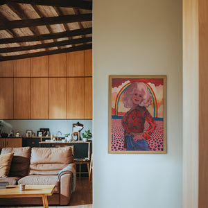 Dolly Parton Rainbow music wall art print by Caya Crum — framed in a wood-accent room