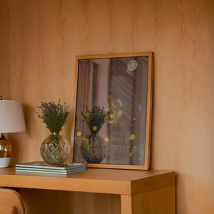 Fire Flies Cowboy at Night western art print by Caya Crum — framed in a wood-accent room