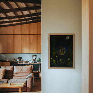 Fire Flies Cowboy at Night western art print by Caya Crum — framed in a wood-accent room