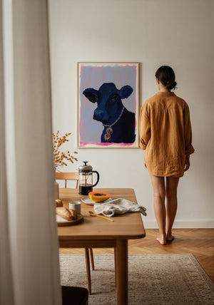 Money Cow pink pop art print by Caya Crum — framed vertical room scene