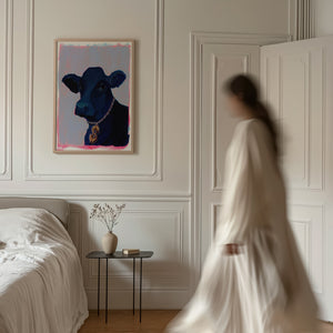 Money Cow pink pop art print by Caya Crum held in a frame — room scene