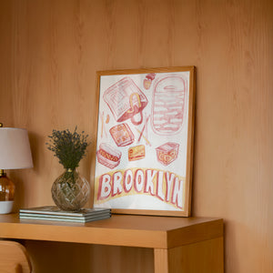Brooklyn city art print by Caya Crum — framed in a wood-accent room