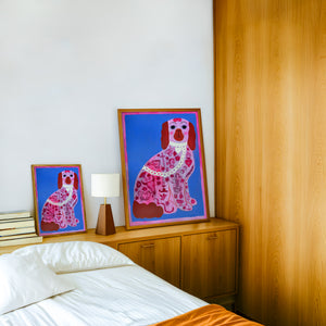 Pink Dog Tattoo dog art print by Caya Crum — framed in a wood-accent room