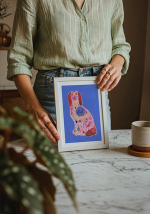 Pink Staffordshire Luck Dog maximalist dog art print by Caya Crum — neutral frame room mockup
