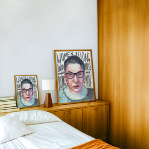 Ruth Bader Ginsburg quote feminist art print by Caya Crum — framed in a wood-accent room