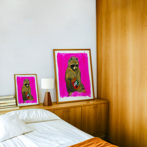 Jiff Raccoon weirdcore art print by Caya Crum — framed in a wood-accent room