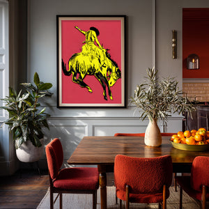 Bronc buster yellow pink rodeo print by Caya Crum framed in a dining room