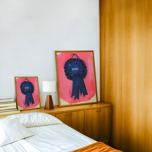 Loser Blue Ribbon retro award ribbon print by Caya Crum — framed in a wood-accent room