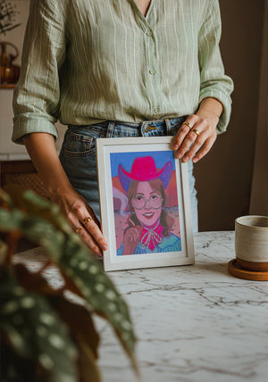 Hanna cowgirl art print by Caya Crum — neutral frame room mockup