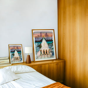 South Congress Beatles Austin print by Caya Crum — framed in a wood-accent room