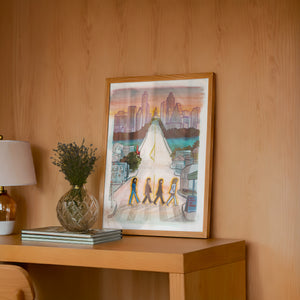 South Congress Beatles Austin print by Caya Crum — framed in a wood-accent room