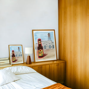 Shiner at Gruene Hall Texas art print by Caya Crum — framed in a wood-accent room
