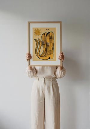 Roach Stompers cowboy boot art print by Caya Crum — framed with velvet mat