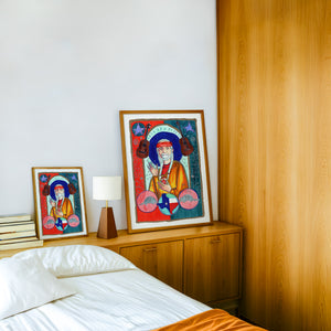 Saint Willie Nelson music wall art print by Caya Crum — framed in a wood-accent room