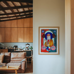Saint Willie Nelson music wall art print by Caya Crum — framed in a wood-accent room