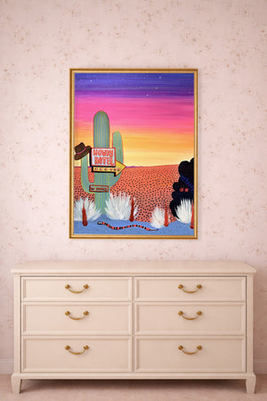 Howdy Hotel cactus and snake print by Caya Crum framed above a dresser