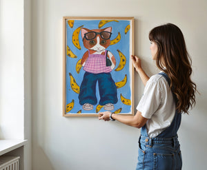 Banana Kitty cat art print by Caya Crum — framed vertical room scene