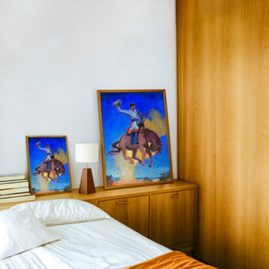 Bronco Buster Night rodeo art print by Caya Crum — framed in a wood-accent room