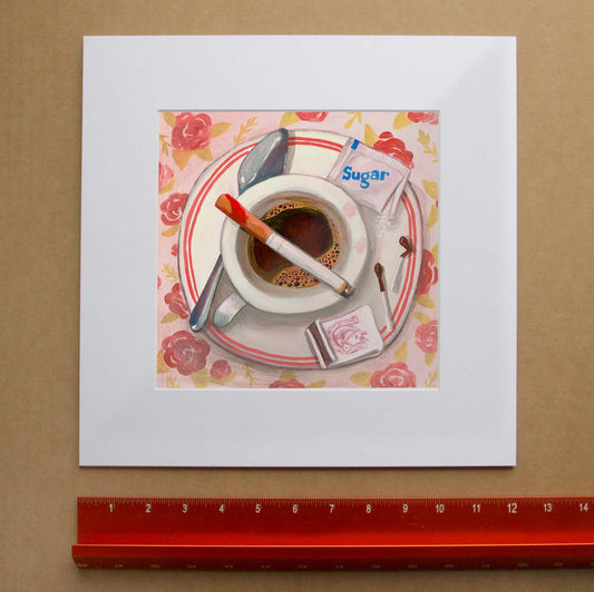 Cigarettes and Coffee art print shown matted by Caya Crum — overhead still life of coffee, a cigarette and a spilled sugar packet, square kitchen wall art at crumart.com. This museum quality print is made right here in Texas.