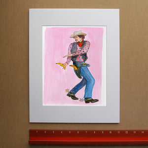 Banana Guns cowboy art print by Caya Crum — framed vertical room scene