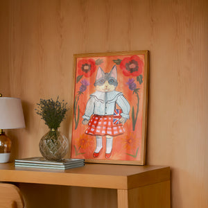 English Schoolgirl Cat cat art print by Caya Crum — framed in a wood-accent room