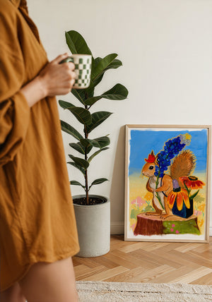 Ms. Squirrel in the Bluebonnets squirrel art print by Caya Crum — framed with velvet mat