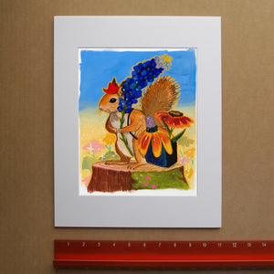 Ms. Squirrel in the Bluebonnets squirrel art print by Caya Crum — framed vertical room scene