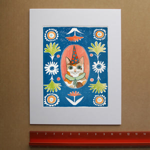 Party Cat Poppett cat art print by Caya Crum — framed room mockup