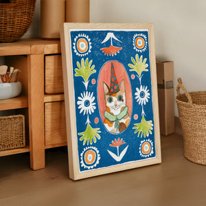 Party Cat Poppett cat art print by Caya Crum — framed vertical room scene