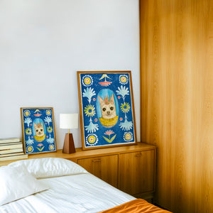 Chip the Party Dog Poppett dog art print by Caya Crum — framed in a wood-accent room