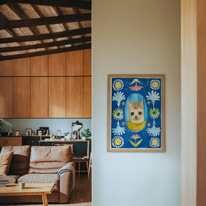 Chip the Party Dog Poppett dog art print by Caya Crum — framed in a wood-accent room