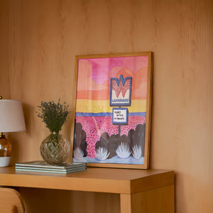 Honey Butter My Biscuits texas art print by Caya Crum — framed in a wood-accent room