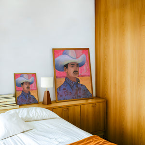 Jesse cowboy art print by Caya Crum — framed in a wood-accent room