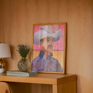 Jesse cowboy art print by Caya Crum — framed in a wood-accent room
