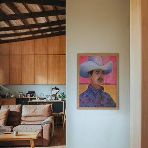 Jesse cowboy art print by Caya Crum — framed in a wood-accent room