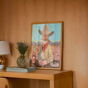 Caya's World Desert Self Portrait Dr Pepper art print by Caya Crum — framed in a wood-accent room