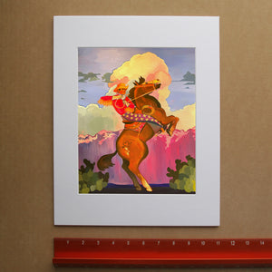 Cowboy art print of a Cowboy wearing chaps with stars on them, he is on his bucking horse with a dramatic sunset in the background with big puffy clouds. 