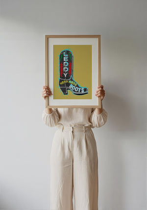 Leddy Boot Ochre cowboy boot art print by Betsy Crum — framed with velvet mat