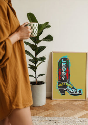 Leddy Boot Ochre cowboy boot art print by Betsy Crum — framed with velvet mat