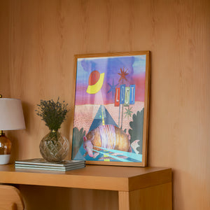 Armadillo UFO Spaceship desert art print by Caya Crum — framed in a wood-accent room