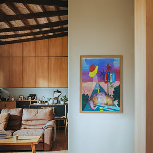 Armadillo UFO Spaceship desert art print by Caya Crum — framed in a wood-accent room