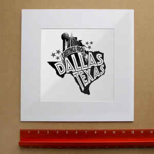 Dallas Art Prints & Gifts – Greetings From Dallas Texas  | Carl Crum Art in matted square frame mockup