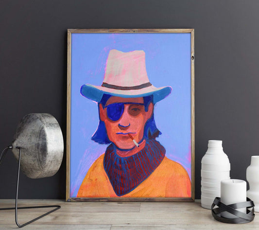 Eyepatch Sam modern cowboy art print by Caya Crum in wooden frame against dark wall with decorative vases
