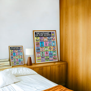 Alphabet Nursery Decor Fort Worth art print by Betsy Crum — framed in a wood-accent room