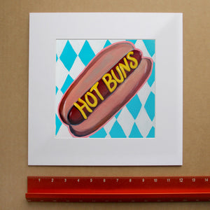 Funny Food Art Hot Buns Print by Caya Crum, inspired by a playful hot dog illustration, mustard lettering, and the sweet, silly energy of summer baseball games, snack stands, and the kind of art that makes people grin, available at crumart.com. This museum quality print is made right here in Texas.