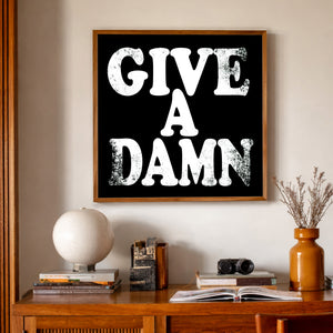 Give a Damn typography print by Betsy Crum framed in a midcentury room