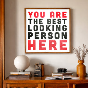 You Are the Best Looking Person Here Print by Carl Crum, a matted archival art print in a gold frame inspired by bold typography, playful confidence, and the extra reassurance you didn’t know you needed, available at crumart.com. This museum quality print is made right here in Texas.