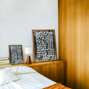 Houston Nicknames Houston art print by Betsy Crum — framed in a wood-accent room